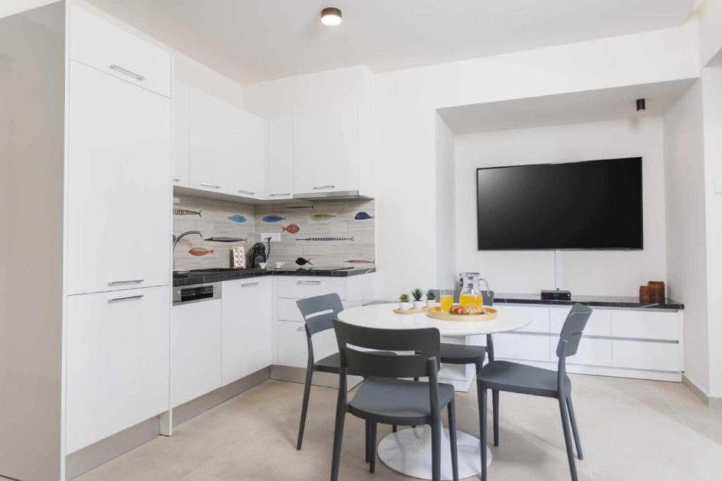 White Sand apartment kitchen with smart TV
